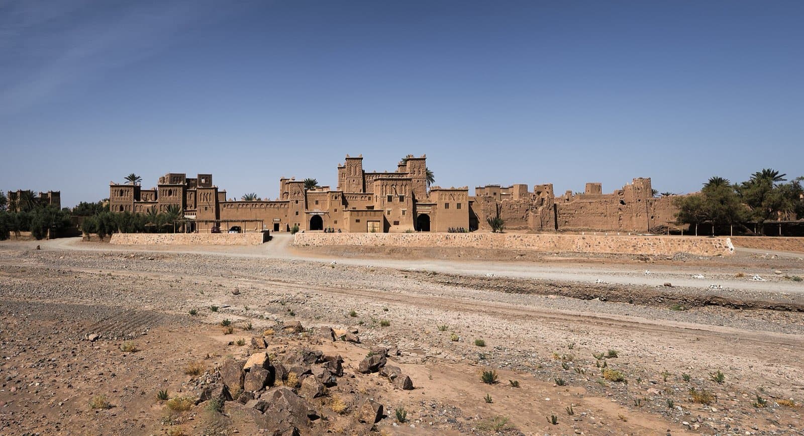 The towers of Kasbah Amridil among palms
