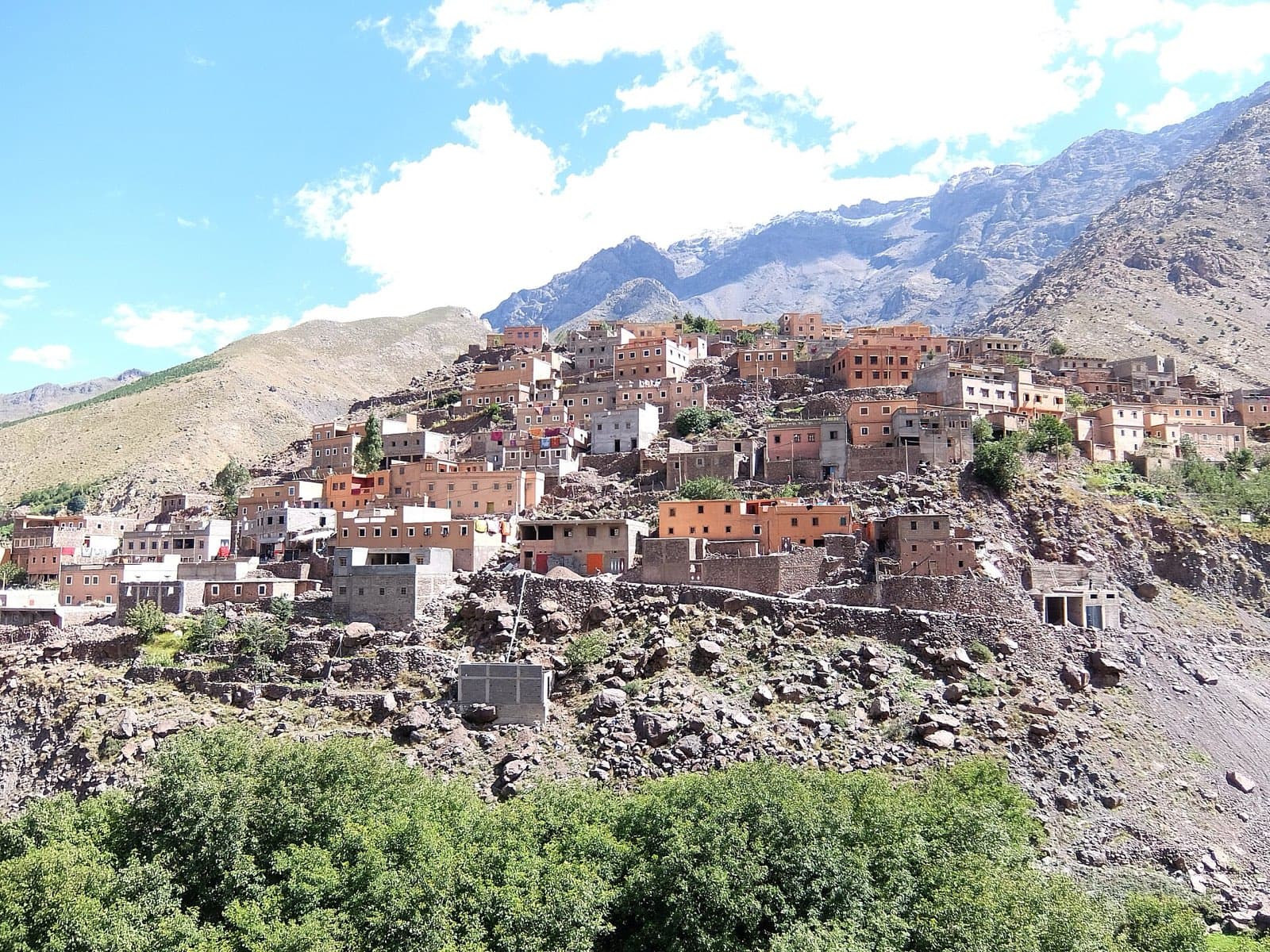 The stone and earth houses of Aroumd stacked on a hillside