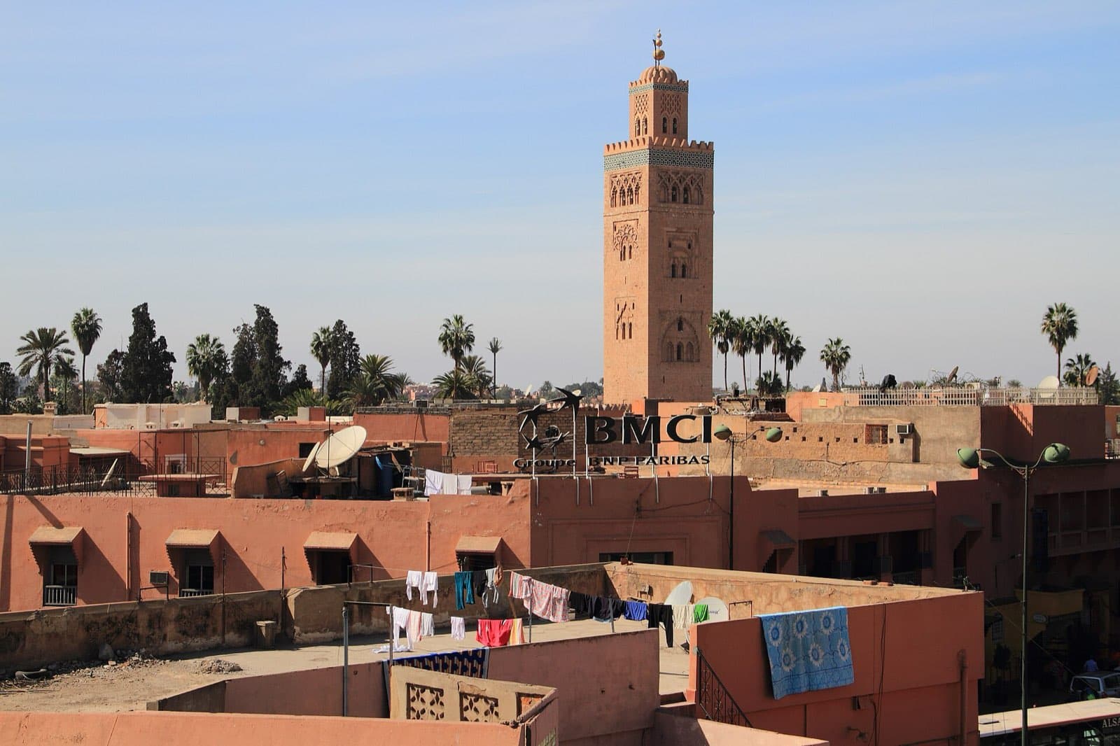 The Koutoubia minaret above flat roofs and palms