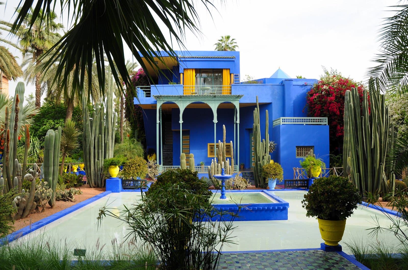 The cobalt-blue Majorelle studio behind cactus and palms