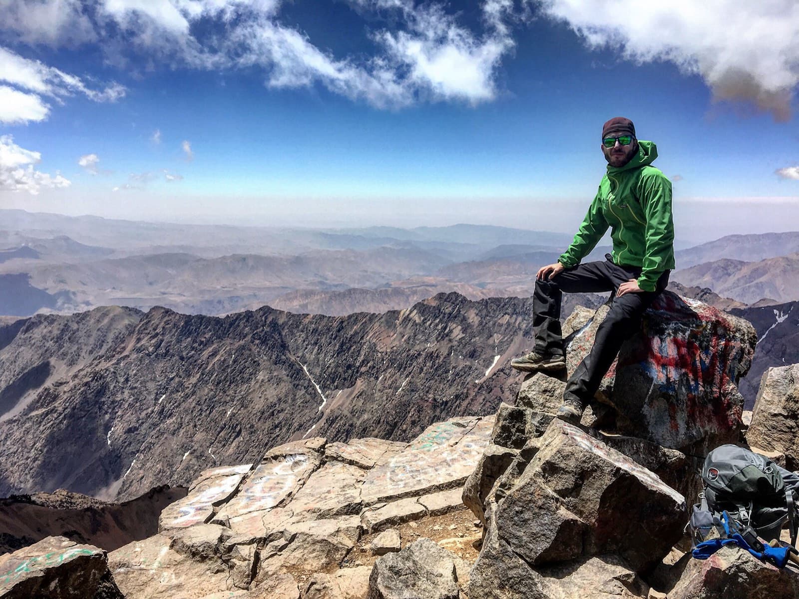 A hiker resting at the summit of Toubkal, 4,167 m